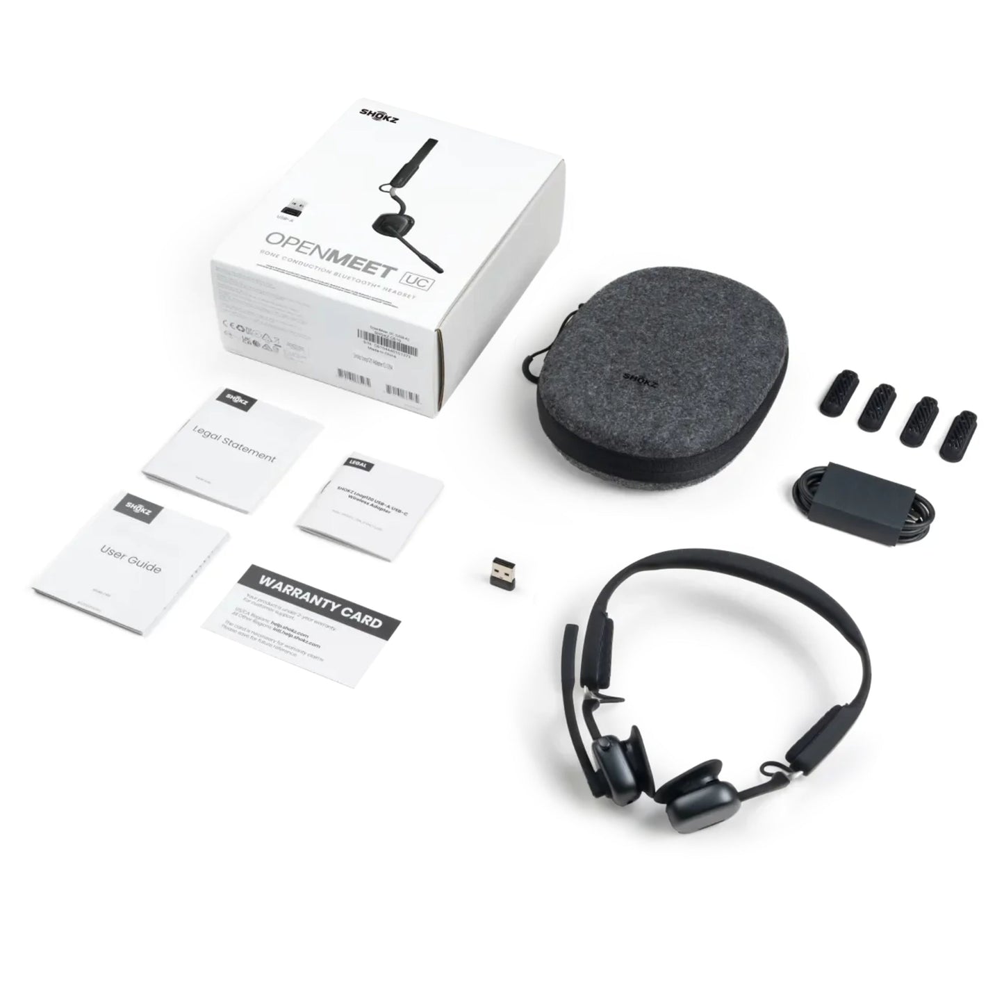 Shokz OpenMeet kontorhovedtelefoner med åbent øre-design, etui, USB-dongle, ekstra ørepuder, kabel og OpenMeet æske.