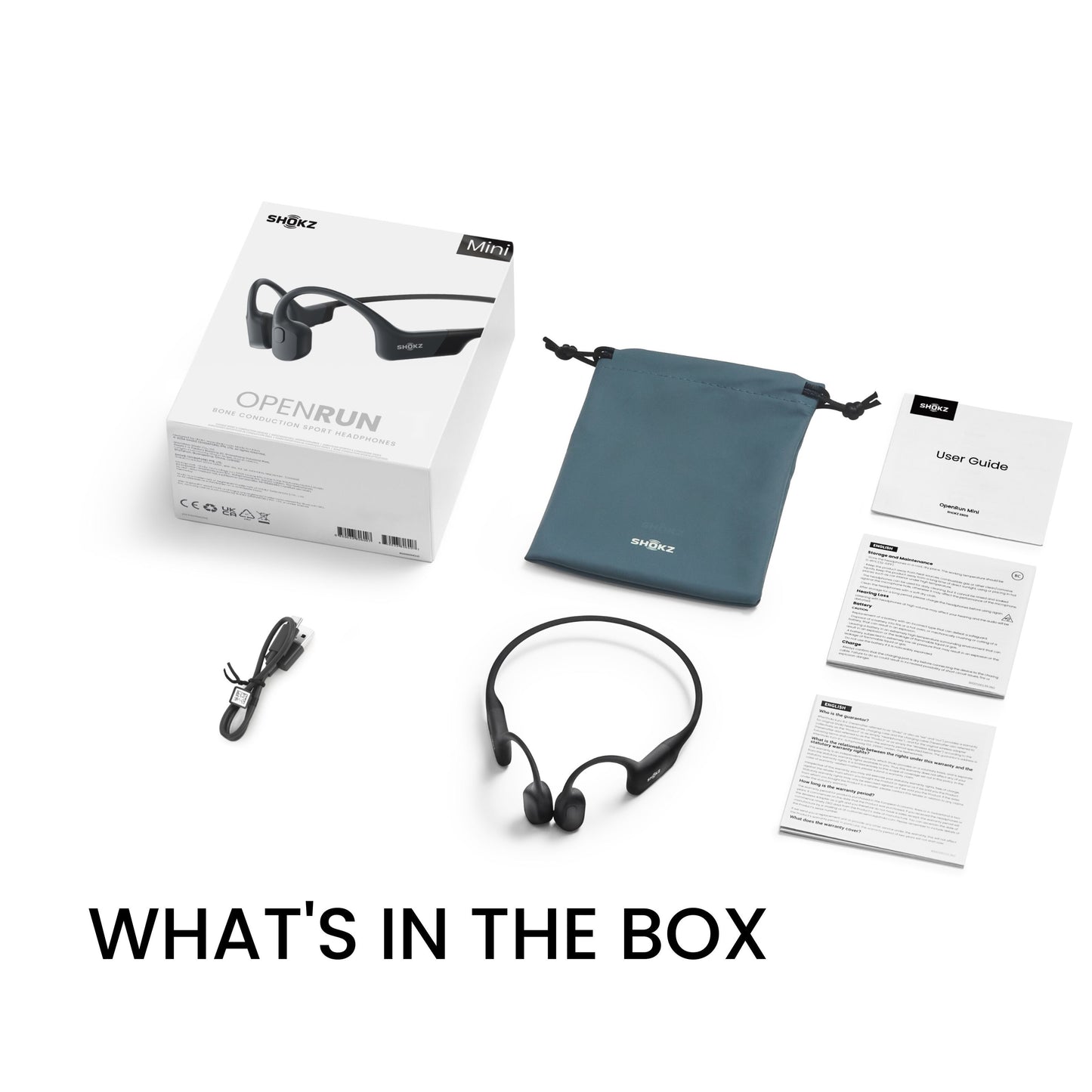Shokz OpenRun Mini trådløse øretelefoner med benledning, USB-C kabel, brugervejledning og grå etui, tekst: HVAD DER ER I KASSEN.