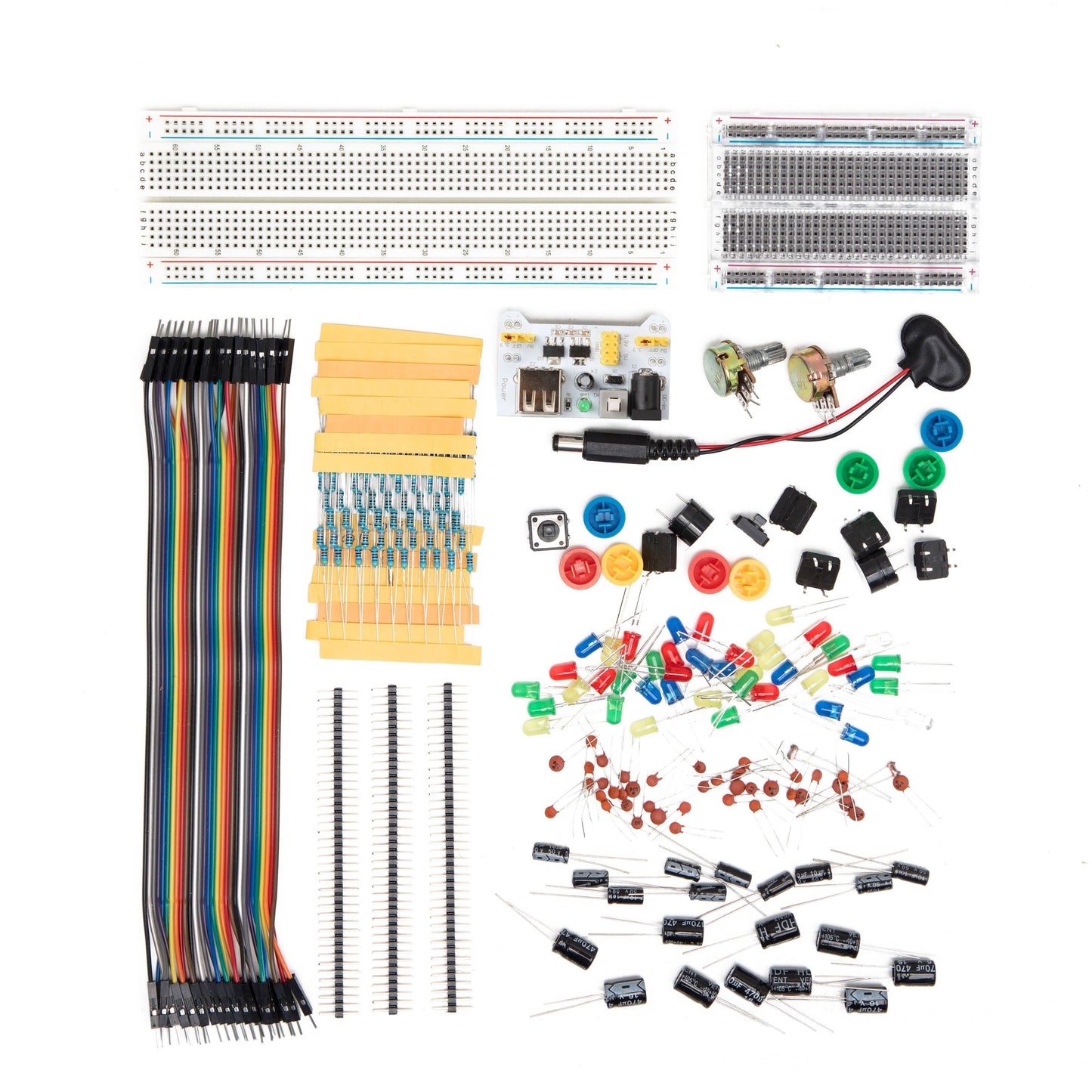 Komponent-sæt til Arduino med breadboards, jumper-ledninger, modstande, kondensatorer, LED'er, potentiometre og strømforsyning.