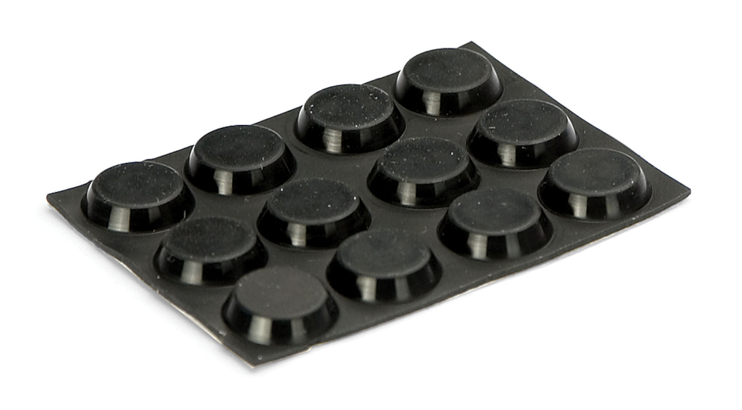 Sort rektangulær plade med 12 runde, hævede Flade apparatfødder i 3x4 gitter, set i let vinkel.