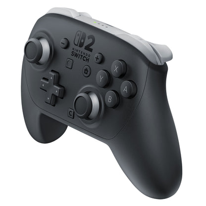 Nintendo Switch 2 Pro Controller sort med grå knapper og analogsticks, Nintendo Switch-logo, standardlayout, bevægelseskontrol.