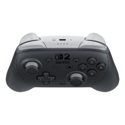 Nintendo Switch 2 Pro Controller sort, set ovenfra, med gennemsigtige skulderknapper og standard knaplayout.