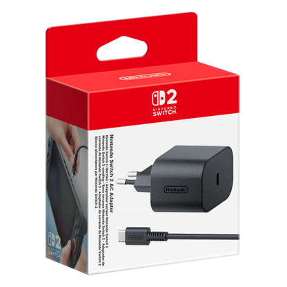 Nintendo oplader til Switch 2 i rød/hvid æske, sorterer adapter og kabel synligt, Nintendo-logo og produktinfo.