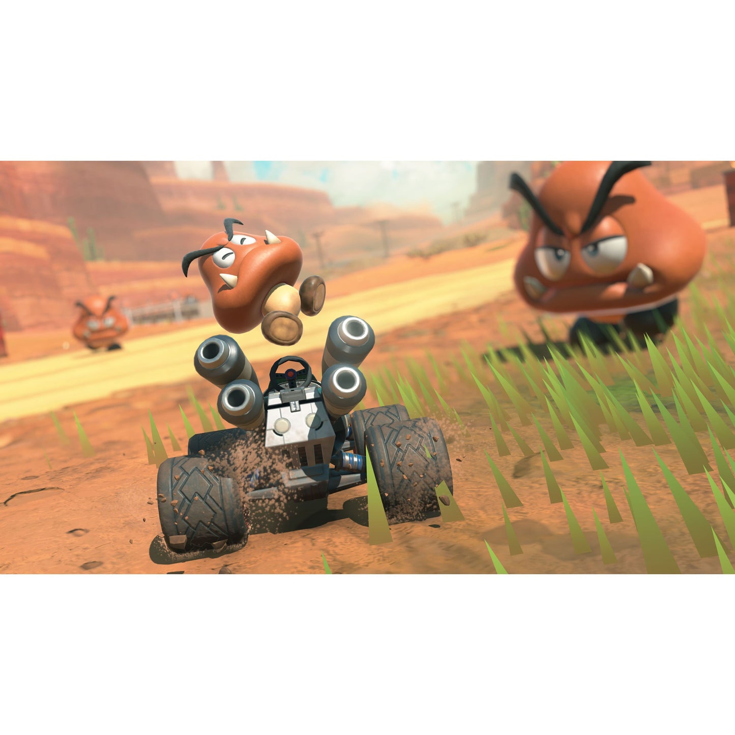 Nintendo Mario Kart Verden Switch 2 legetøjs-gokart med Goomba-figur og to animerede Goombas på ørkenbane.