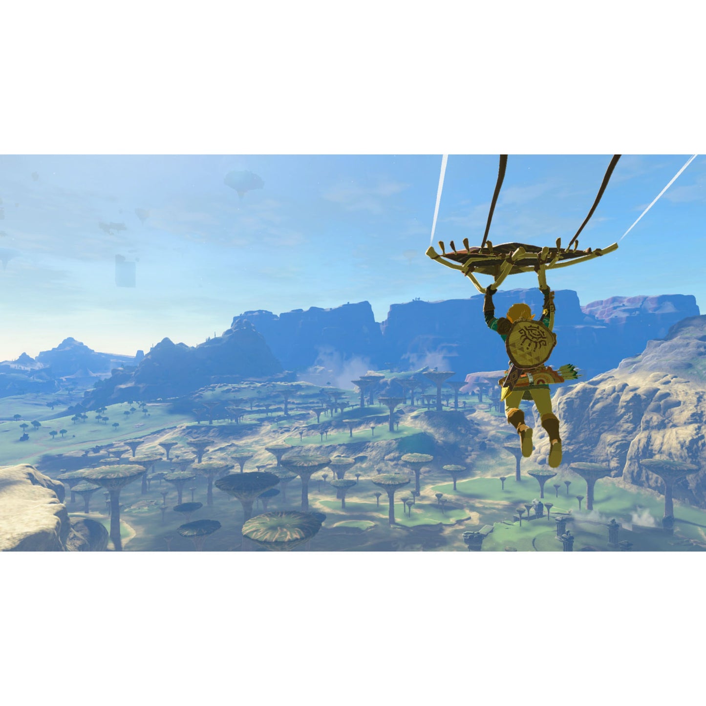 Legenden om Zelda: Rigerens tårer Switch 2-udgave spilcover med gul karakter med faldskærm over landskab.
