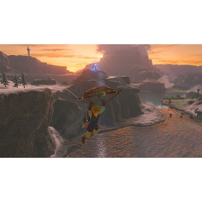 Legenden om Zelda: Breath of the Wild Switch 2-udgave spilcover med karakter over kløft, paraglider og blå struktur.