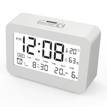 Luxorparts rejsealarm digitalt display viser tid 12:08 PM, temperatur 20°C, luftfugtighed 63, ugedag, dato og alarmtid.
