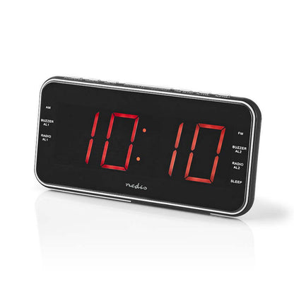 Vækkeur med FM-radio, stort rødt LED-display viser 10:10, dobbelt alarm, radio- og buzzer-alarm, mærkede knapper.