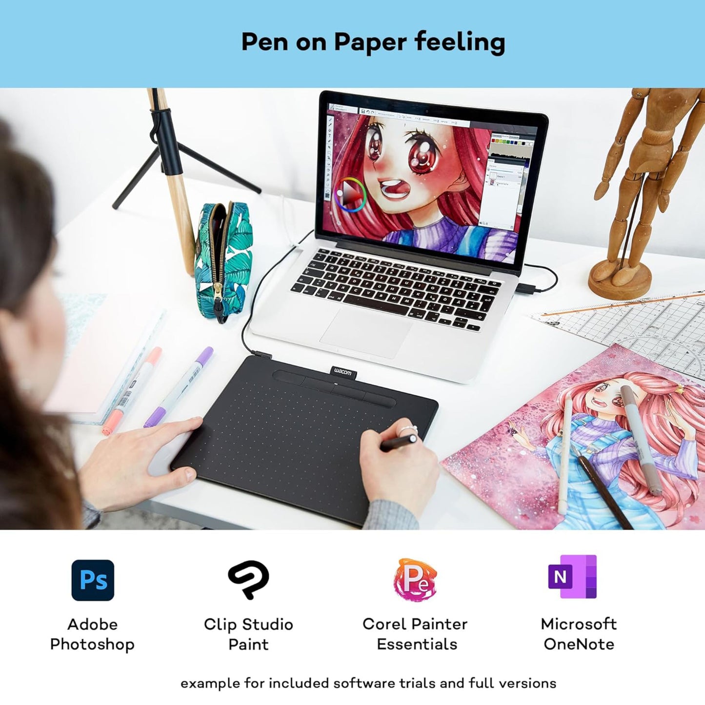 Wacom Intuos Medium tegneplade Sort tilsluttet laptop med anime-tegning, Adobe Photoshop og Clip Studio Paint logoer synlige.