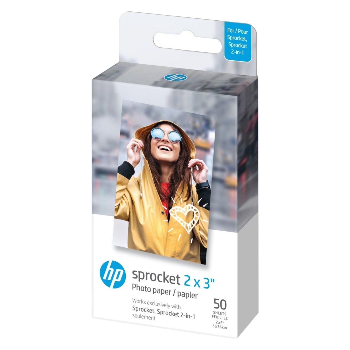 HP Zink fotopapir 50 stk 5x7,6 cm til Sprocket printer, emballage med kvinde i gul jakke og solbriller.