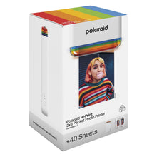Polaroid Hi-Print Gen 2 Kit Hvid æske med regnbuedesign, 40+ ark, for bærbar smartphone fotoskriver, kvinde blæser tyggegummiboble.
