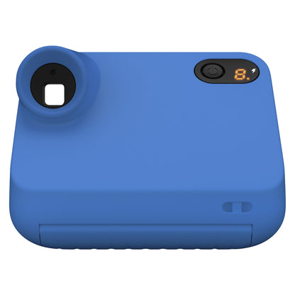 Polaroid Go Gen2 instantkamera set oppefra med objektiv, tænd/sluk-knap, digitalt display og slots til film på fronten.