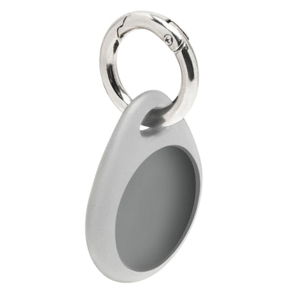 Linocell AirTag nøglering grå, oval form med glat overflade, rund forsænket midte og sølvfarvet metalnøglering.