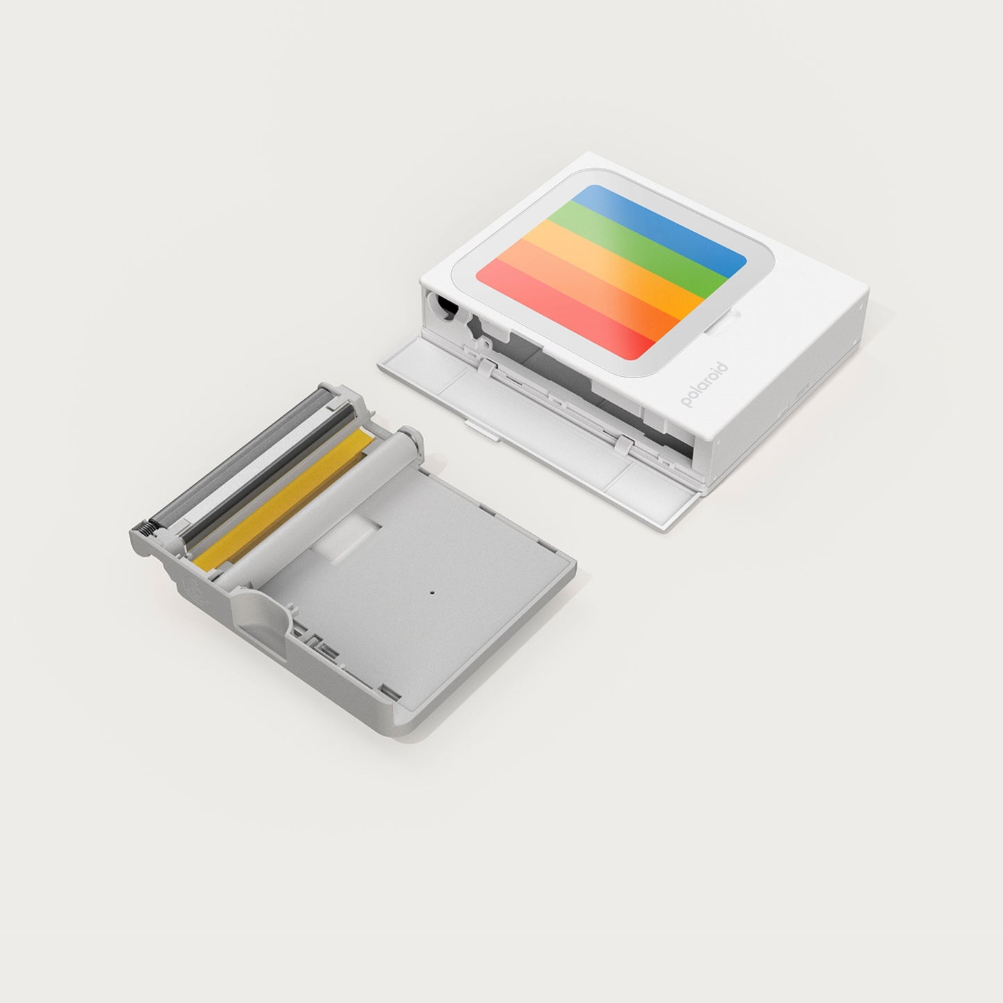 Polaroid Hi-Print 3x3 bærbar fotoskriver åben, regnbuestribet design, indvendigt rum og printerbakke synlig.