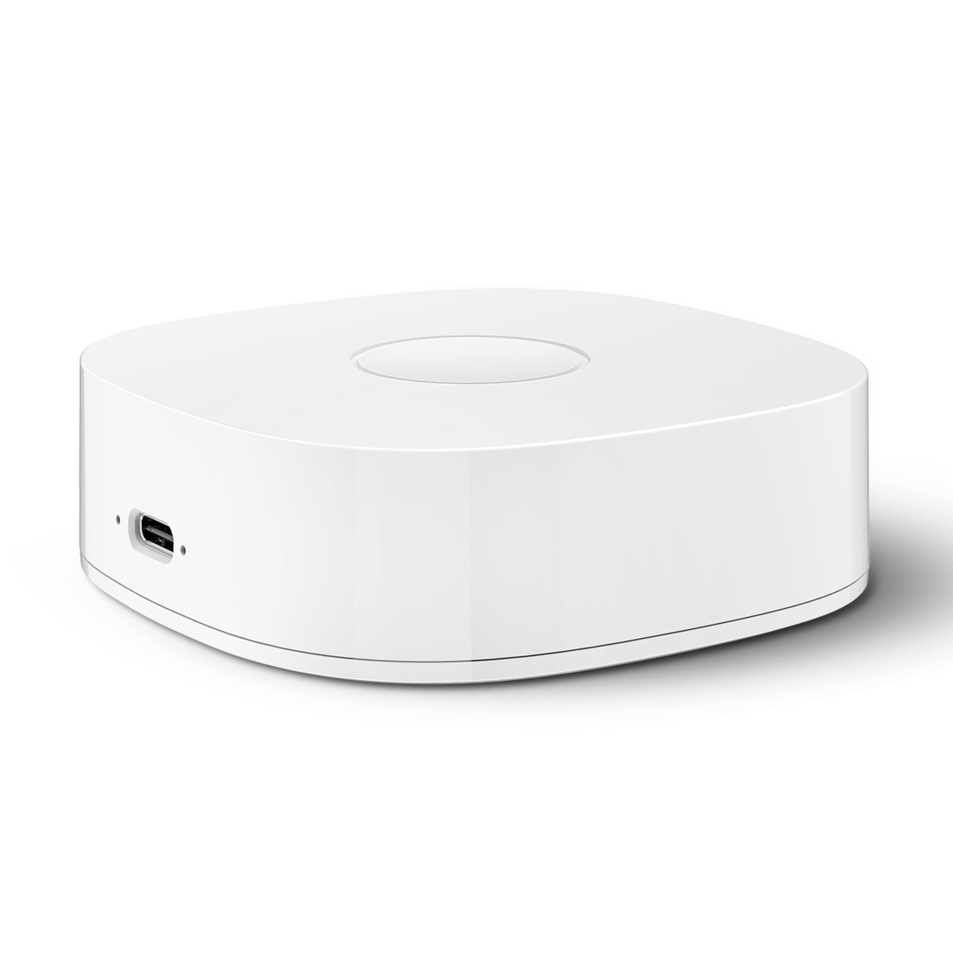 Housegard Luma smart hub, hvid, kvadratisk med afrundede kanter, front USB-port og cirkulær fordybning på toppen.