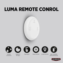 Housegard Luma trådløs fjernbetjening hvid, rund, "LUMA REMOTE CONTROL", ikoner til trådløs, magnet, tape, test/pause.