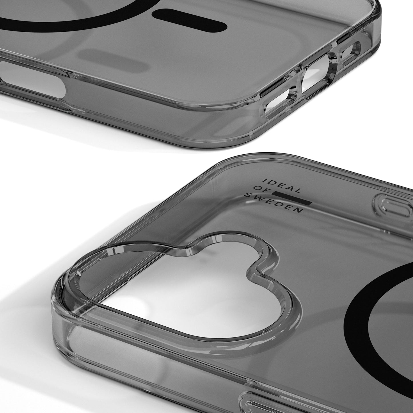 IDEAL OF SWEDEN Clear MagSafe Case til iPhone 17 Tinted Black med runde kanter, hjerteformet kamerahul og sort logo indeni.