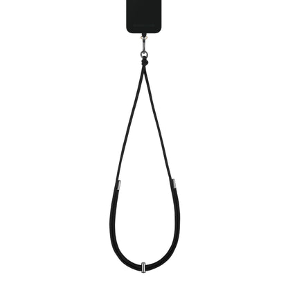 IDEAL OF SWEDEN Cord Phone Strap sort cover med justerbar rem i metaldetaljer, løkke til at bære mobilen om halsen.