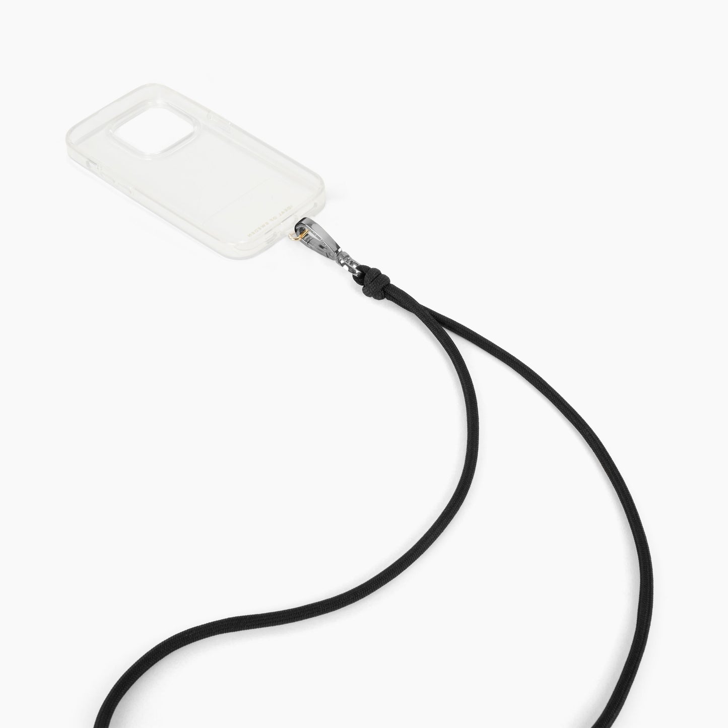IDEAL OF SWEDEN Cord Phone Strap, sort justerbar mobilrem med knude og metalclip til gennemsigtige mobilcovers.