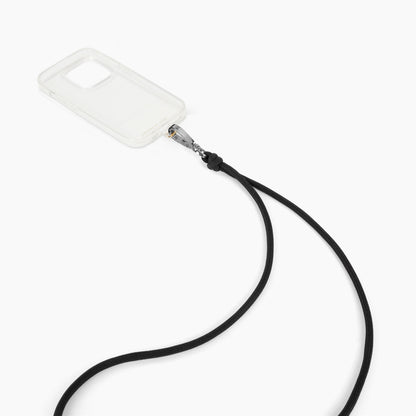 IDEAL OF SWEDEN Cord Phone Strap, sort justerbar mobilrem med knude og metalclip til gennemsigtige mobilcovers.