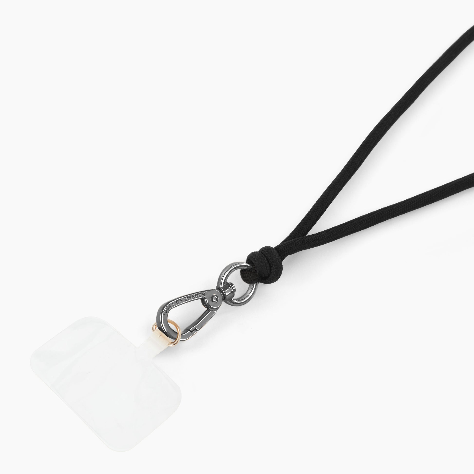 IDEAL OF SWEDEN Cord Phone Strap, justerbar sort snor, sølv karabinhage, gennemsigtig klæbepude.