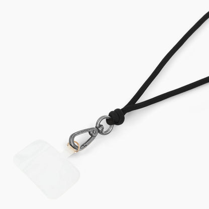 IDEAL OF SWEDEN Cord Phone Strap, justerbar sort snor, sølv karabinhage, gennemsigtig klæbepude.
