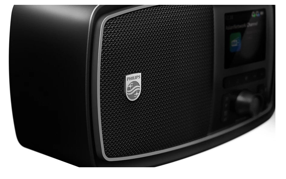 Philips The Janet sort bærbar retroradio med DAB+ og Bluetooth, frontgitter med Philips-logo og kontrolknapper til højre.