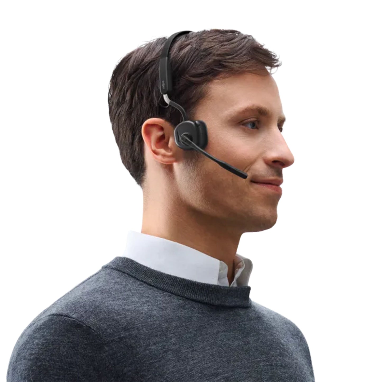 Shokz OpenMeet sort trådløst kontorheadset med mikrofon og åben øre-design bæres af mand iført grå sweater og hvid skjorte.