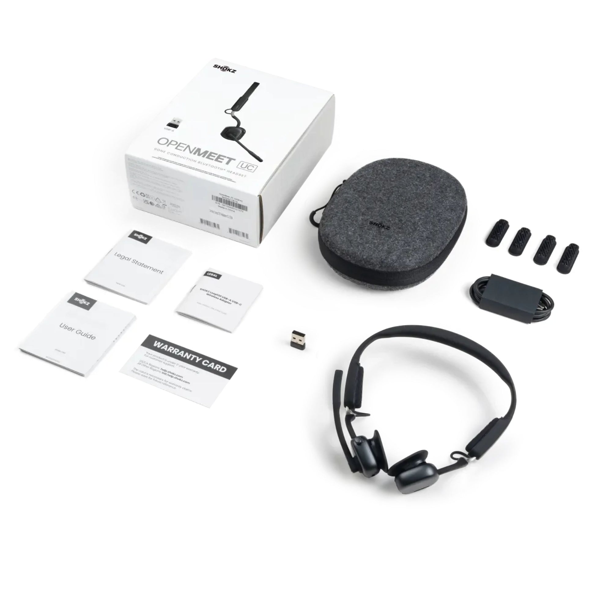 Shokz OpenMeet kontorhovedtelefoner med åbent øre-design, etui, USB-dongle, ekstra ørepuder, kabel og OpenMeet æske.