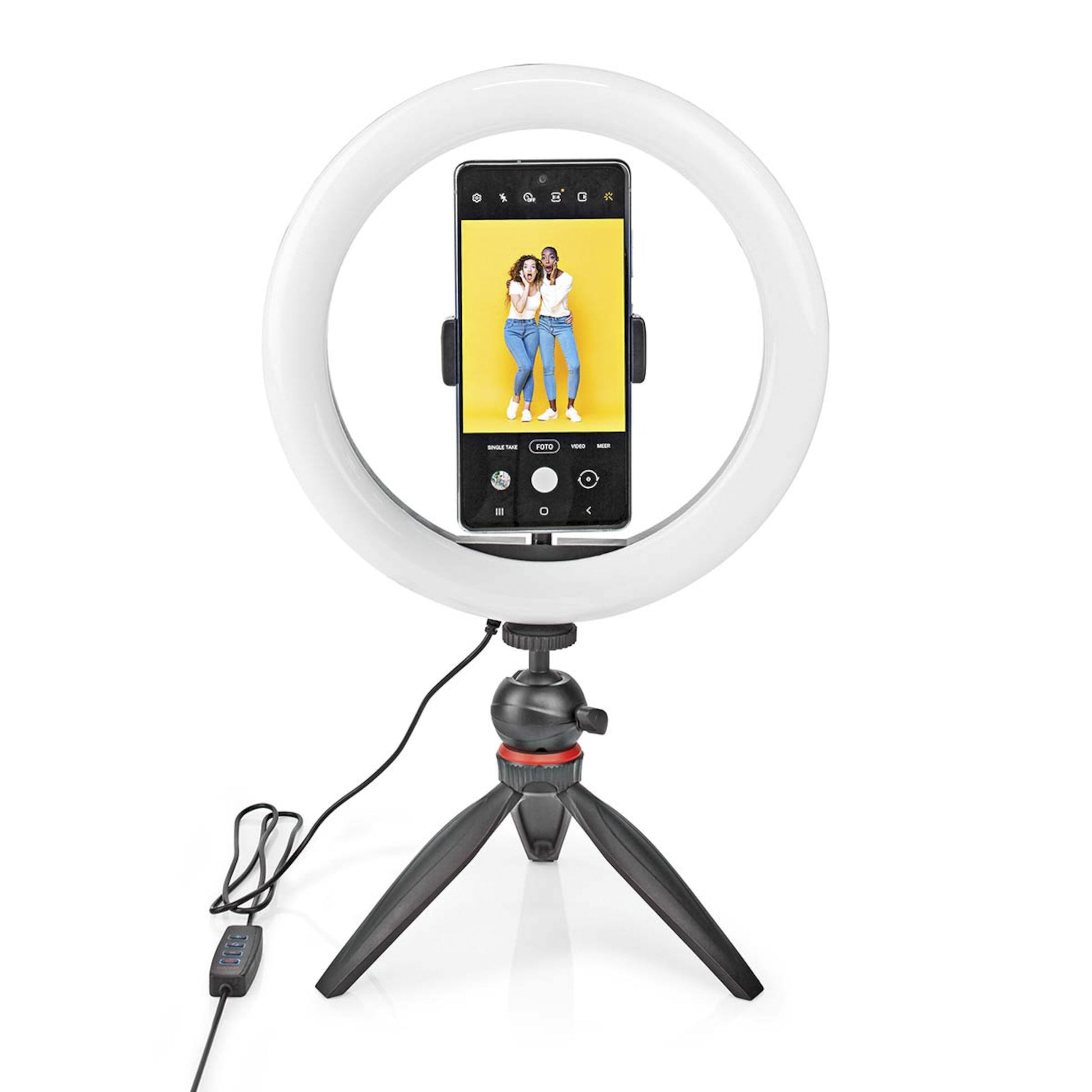 Nedis Ring Light 10" ringbelysning med stativ og USB-kontrol, holder smartphone med to personer på gul baggrund.