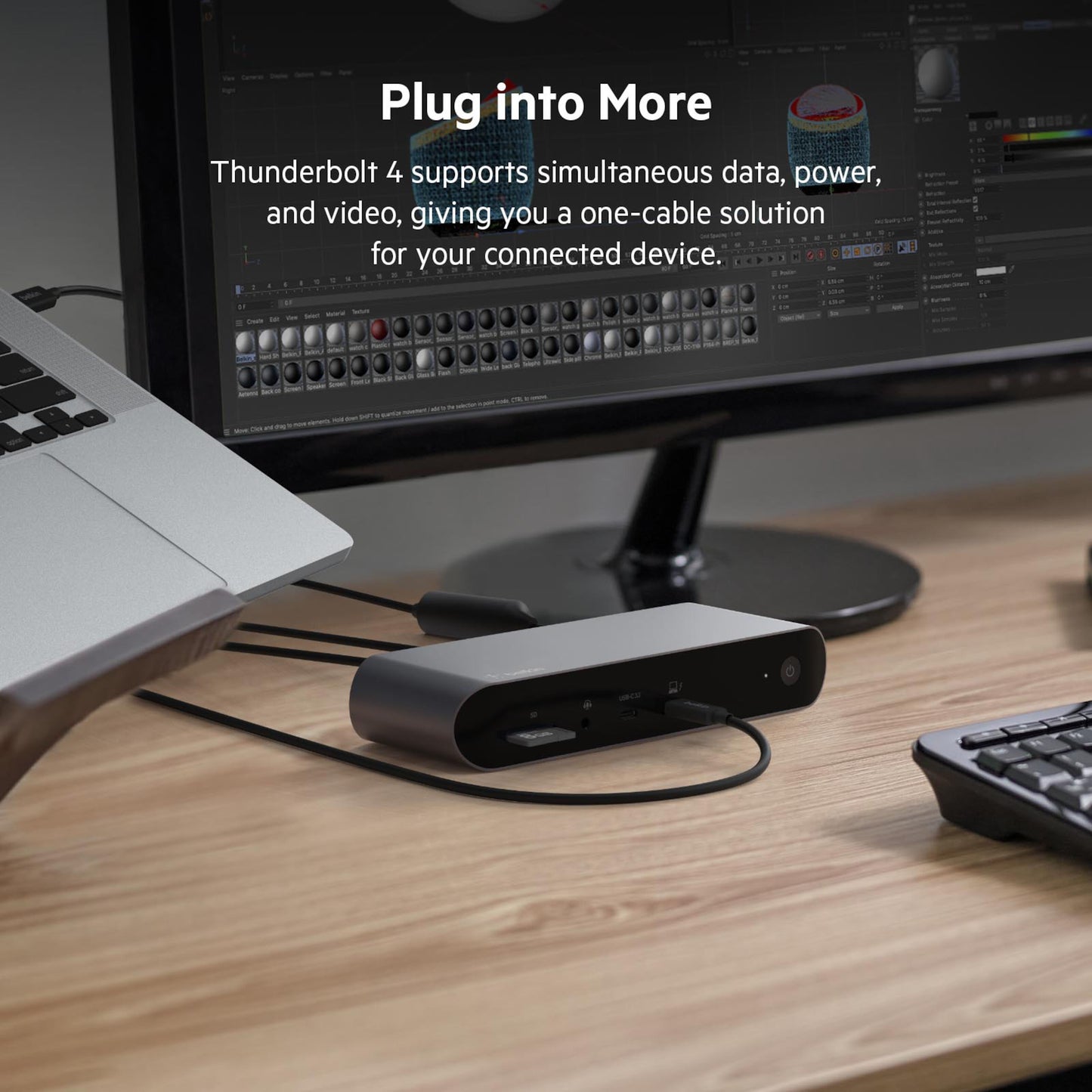 Belkin Thunderbolt 4 Aktiv USB-C-kabel 2 m tilsluttet laptop, skærm og tastatur på træbord, understøtter data, strøm, video.