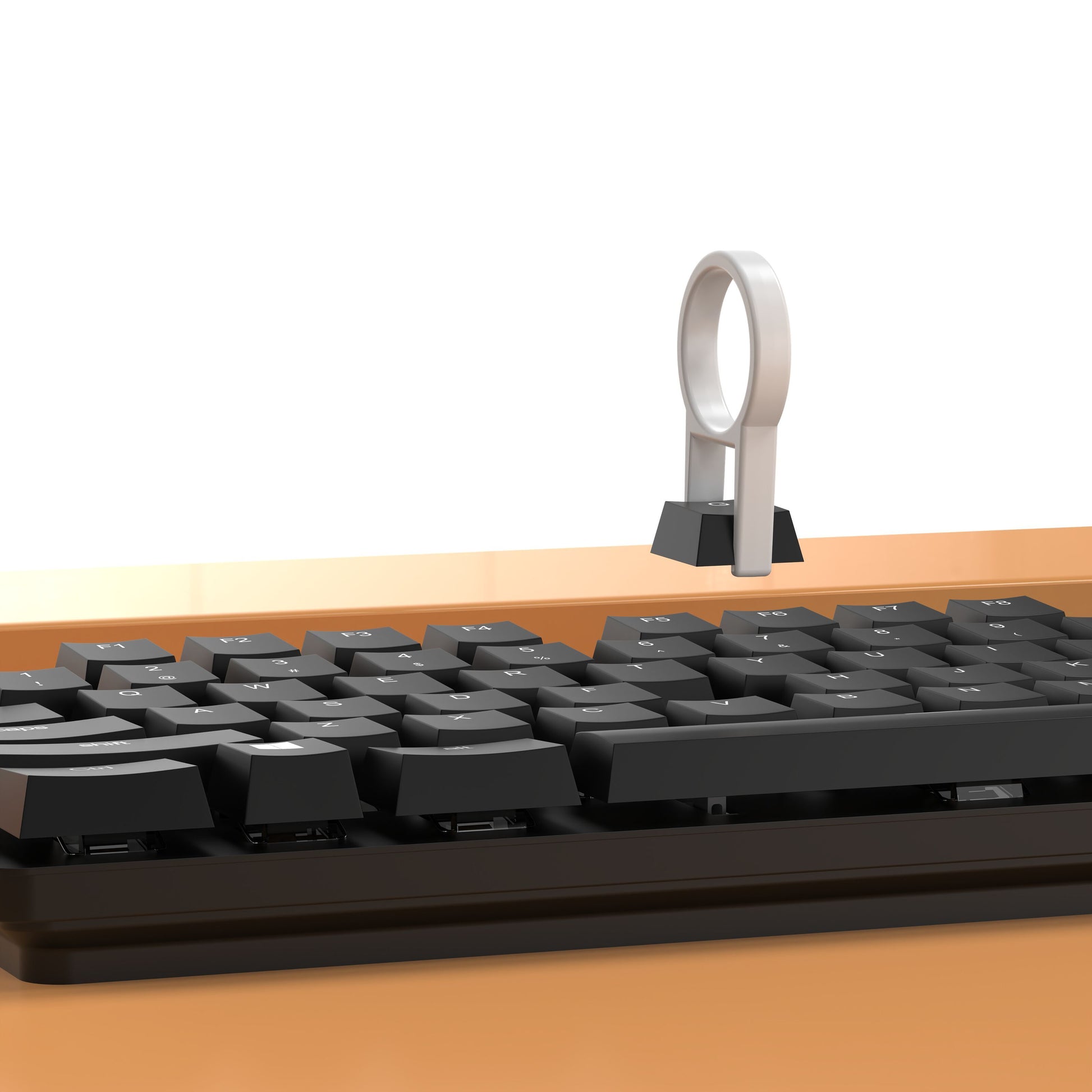Luxorparts 20-i-1 rengøringskit fjerner smag fra sort tastatur med keycap puller på træbord.