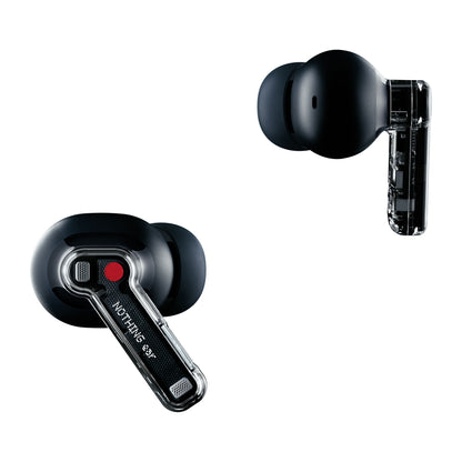 Nothing Ear sort trådløse høretelefoner med transparent stilk, en med rød prik og label, aktiv støjreduktion.
