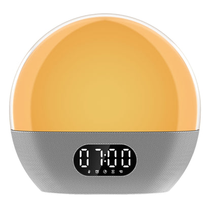WiiM Vækkeur wake-up light med solopgangssimulering, gul-orange lys, digitalt display 07:00, sølvfod med kontrolikoner.