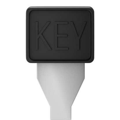 Nøgleformet værktøj med sort, rektangulært hovedmarkeret "KEY" og metallisk skaft til justerbar netadapter 3-12 V.