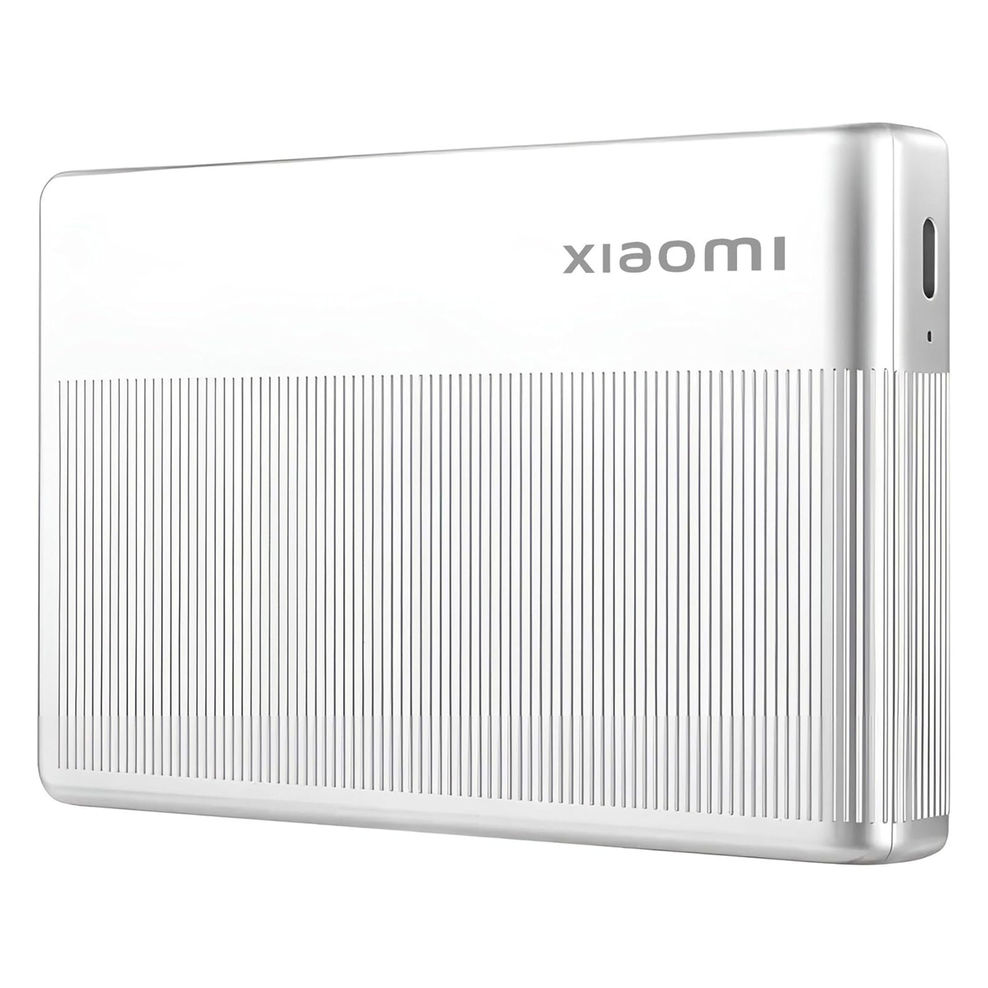 Xiaomi ekstern harddisk sølv, ribbet bund, Xiaomi logo på toppen.