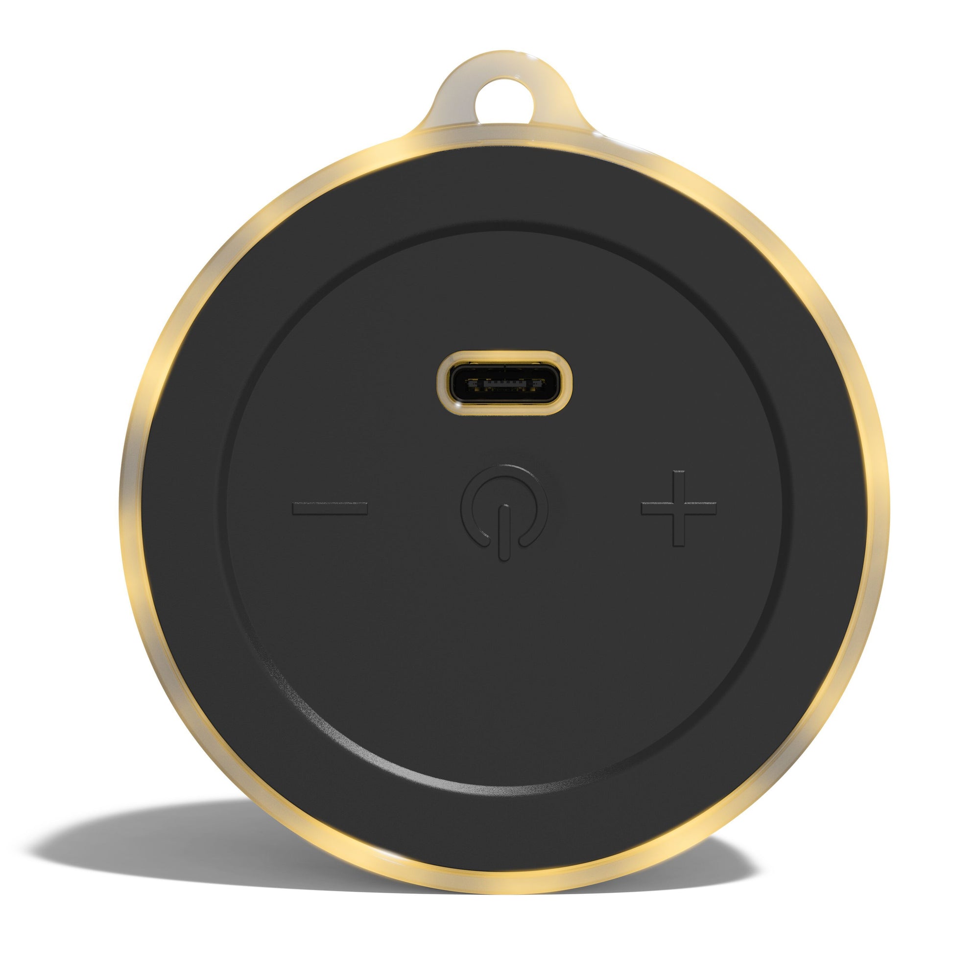 Nomadelic Loud 01 magnetisk Bluetooth-højttaler, sort og guld, rund med centrale knapper og mikro-USB-port på toppen.