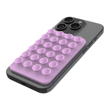 Sortér smartphone med rosa Fixed MagMate MagSafe sugekop-holder med magnetfeste og flere sugekopper på bagsiden.