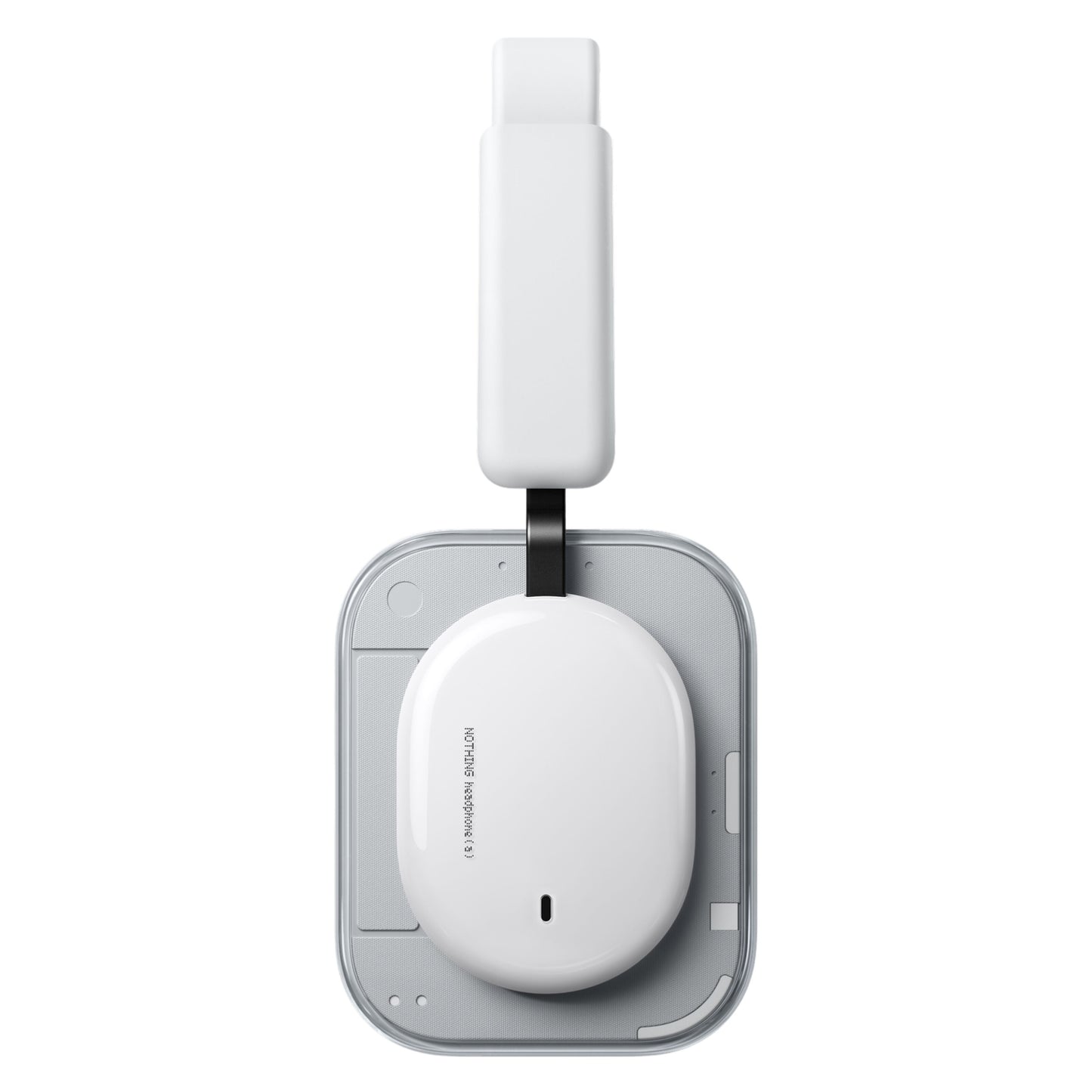 Nothing Headphone (a) trådløse over-ear høretelefoner i hvidt etui på grå opladningspad med hvid, lodret arm og sort kabel.