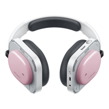 Nothing Headphone (a) trådløse over-ear høretelefoner, pink ørekopper, hvidt/sølv stel, sorte puder, synlige knapper/porte.
