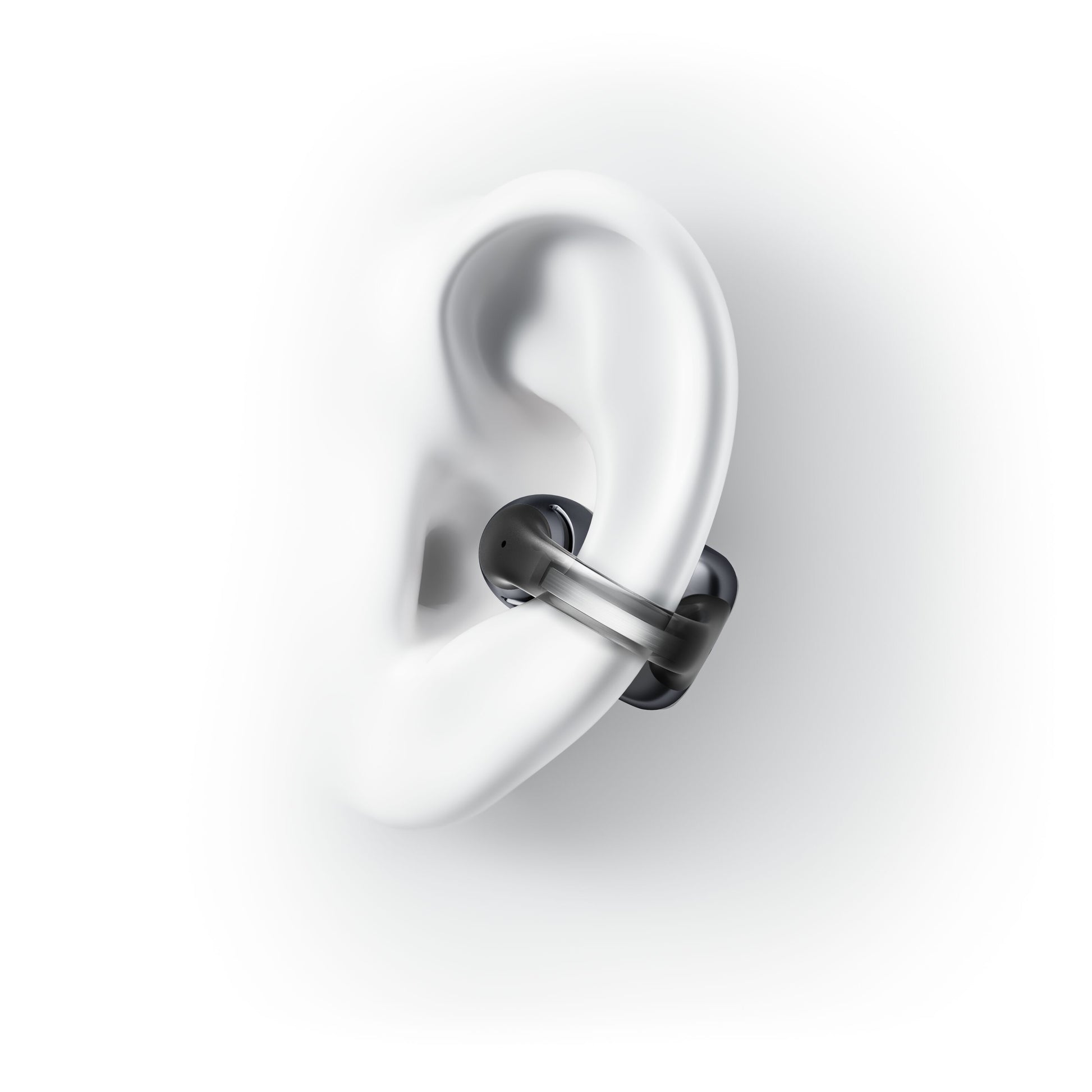 Shokz OpenDots One trådløse åbne clip-on høretelefoner sort vises klemt fast på yderkanten af et øre.
