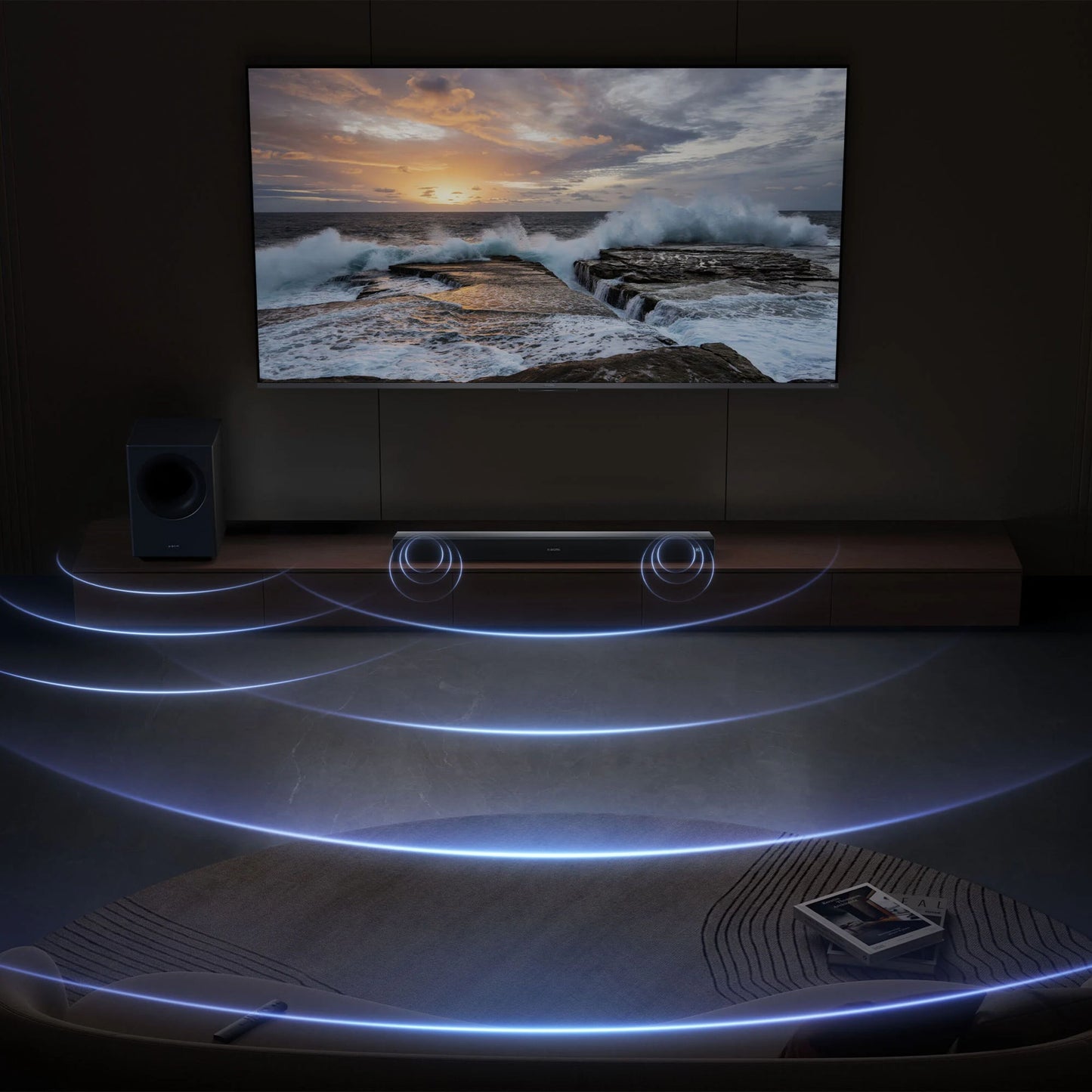 Xiaomi Soundbar Pro 2.1 ch 300 W Dolby Audio og trådløs subwoofer under vægmonteret TV med havsolnedgang.