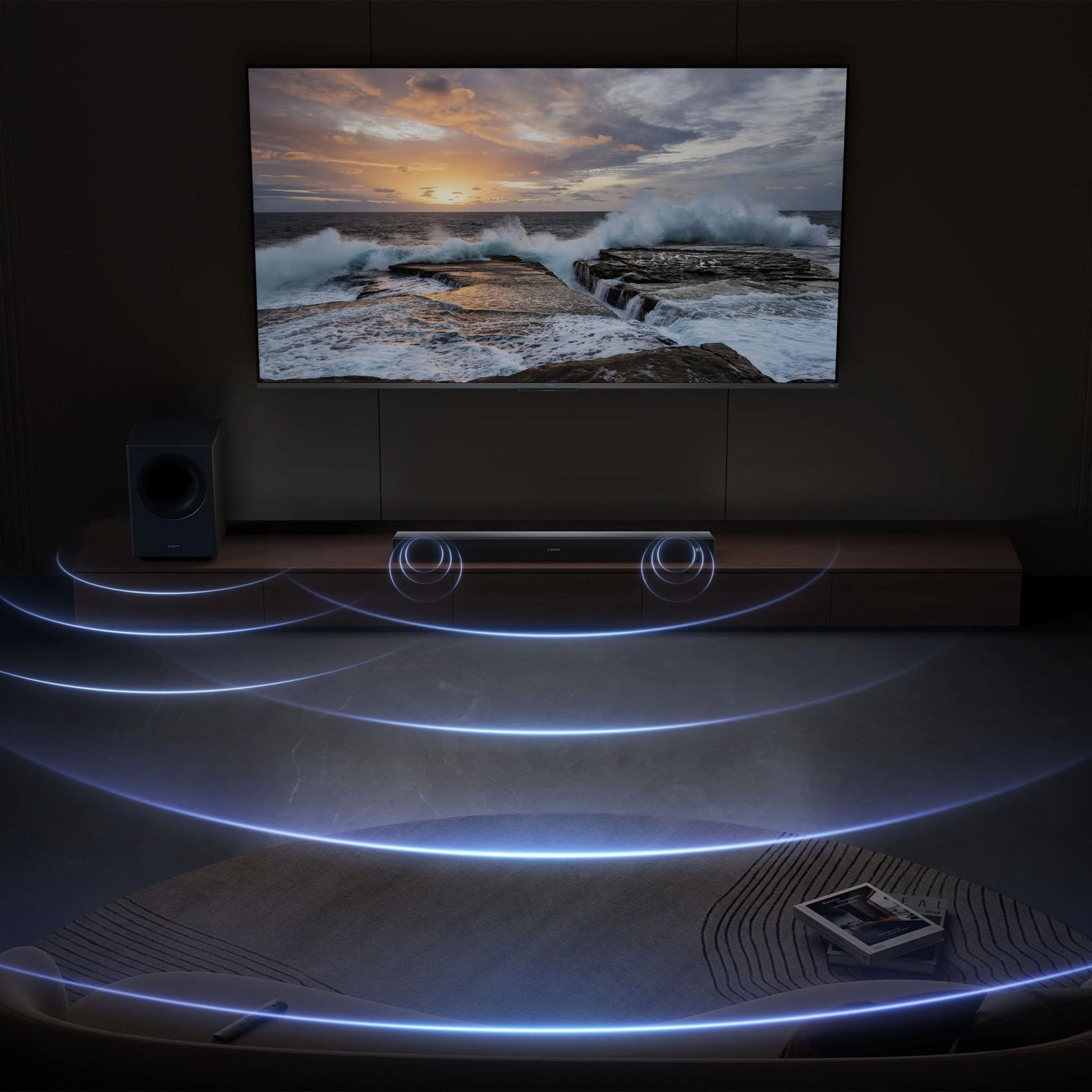 Xiaomi Soundbar Pro 2.1 ch 300 W Dolby Audio og trådløs subwoofer under vægmonteret TV med havsolnedgang.