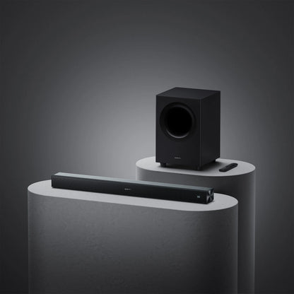 Xiaomi Soundbar Pro 2.1ch 300W med trådløs subwoofer og fjernbetjening, sort, Dolby Audio-logo synligt.