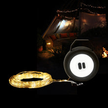 Luxorparts bærbar campinglygte med gul LED-lysliste, sort rund lanterne, telt med lysguirlander i baggrunden.