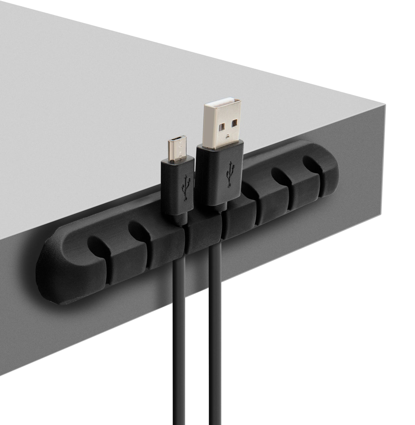 Luxorparts selvklæbende kabelholder sort monteret på grå bordplade holder USB- og mikro-USB-kabel adskilt.
