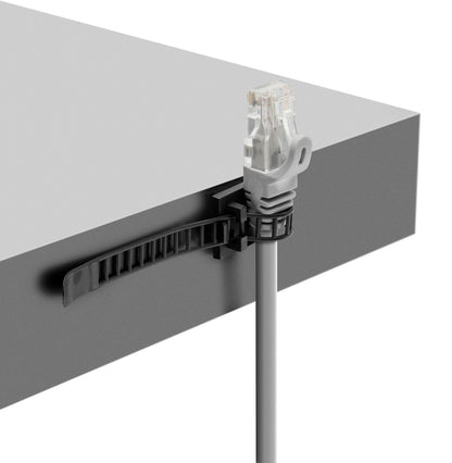 Luxorparts selvklæbende kabelbindere til gråt Ethernet-kabel monteret på kanten af gråt bord for kabelstyring.