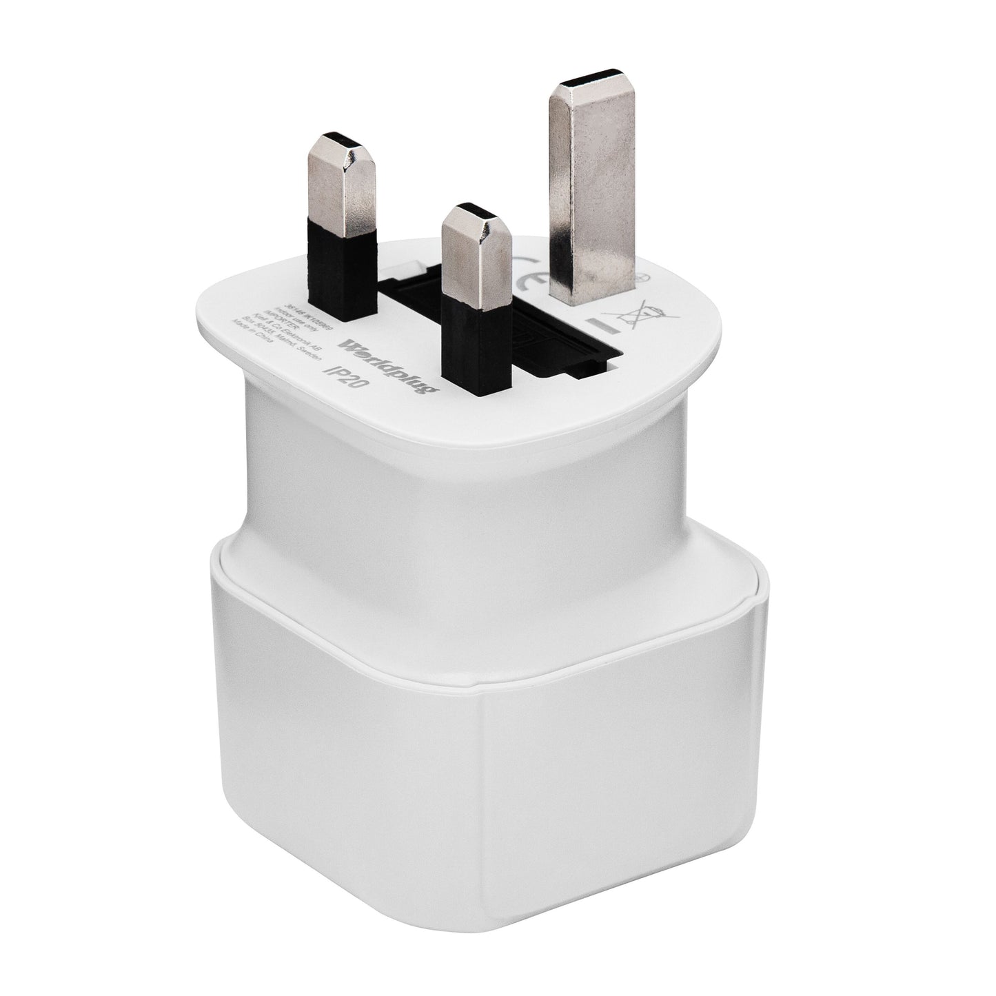Luxorparts jordet rejseadapter UK med metalliske stikben, rektangulært design og tekst/symboler på overfladen.