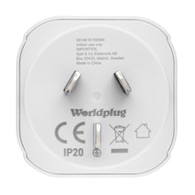Jordet rejseadapter Australien/Kina, hvid, tre skrå ben, "Worldplug"-label, certifikationsmærker, produceret i Kina.