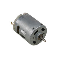 DC-motor 6-14 V, cylindrisk metalkabinet, ventilationsslidser, aksel og to terminaler.